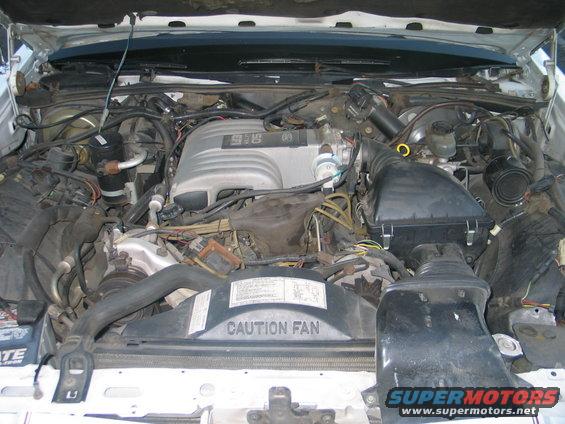 Engine bay of a 1988 Mercury Grand Marquis showing the V8 engine and air intake system