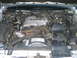 1988 Mercury Grand Marquis - The engine bay of a 1988 Mercury Grand Marquis, its V8 engine and associated components.