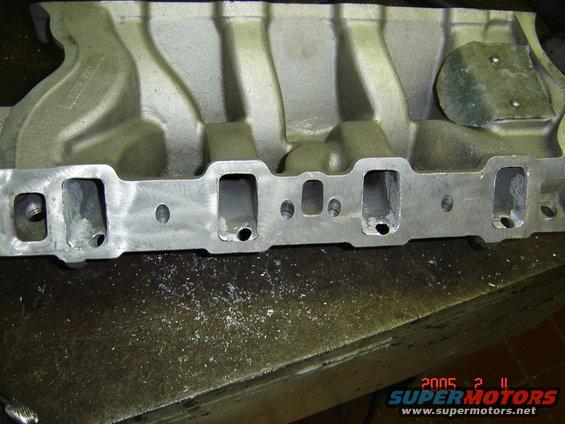 Aluminum intake manifold with visible ports and casting marks