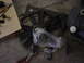 1998 Volkswagen Jetta - Radiator fan assembly and tools on a concrete floor.
