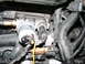 1998 Volkswagen Jetta - Close-up view of various engine components, including sensors and hoses, within a vehicle's engine bay.