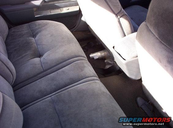 Gray velour rear seats and door panel of a 1991 Ford Crown Victoria LTD