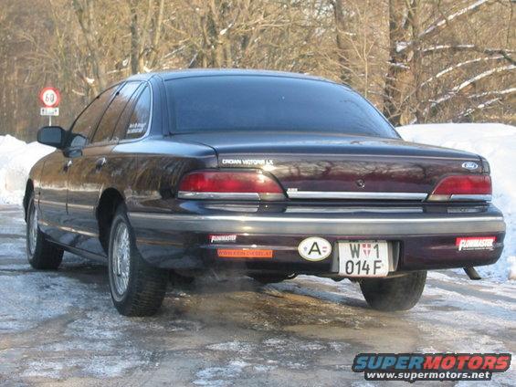 Dark red 1992 Ford Crown Victoria LX rear view with Flowmaster stickers