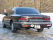 1992 Ford Crown Victoria - A 1992 Ford Crown Victoria LX is seen from the rear in a snowy environment, displaying Flowmaster stickers on the bumper.