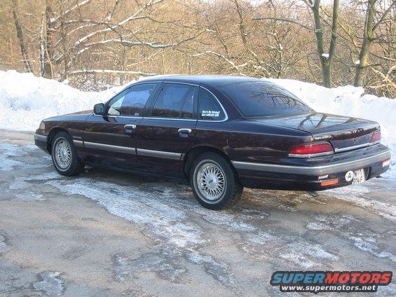 1992 Ford Crown Victoria parked on a snowy road, rear view