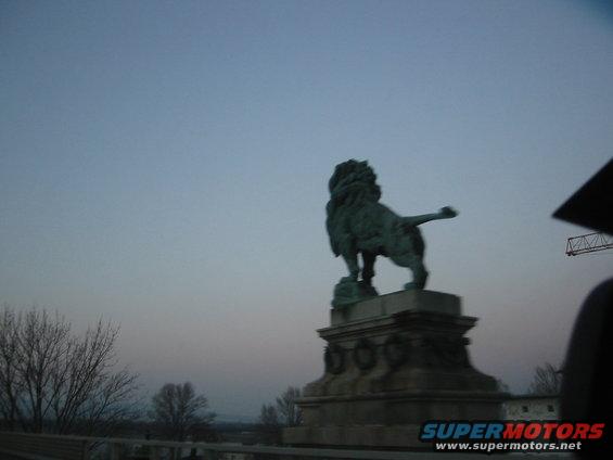 Lion statue against a twilight sky