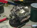 1981 Chevrolet C/K Pickup - Engine assembly is suspended by an engine hoist, ready for installation or removal.