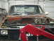 1981 Chevrolet C/K Pickup - This truck appears to be undergoing some form of repair or restoration, with its engine bay completely empty.