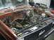 1981 Chevrolet C/K Pickup - The engine bay of a 1981 Chevrolet C/K Pickup is shown with the engine removed, revealing the firewall and surrounding components.
