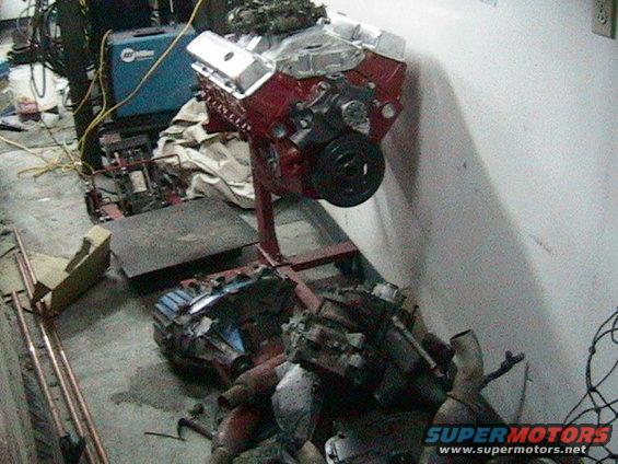 Red engine on stand with chrome valve covers
