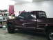 1981 Chevrolet C/K Pickup - This maroon pickup truck, likely from the early 1990s, is shown in a garage with a Confederate flag in the background.