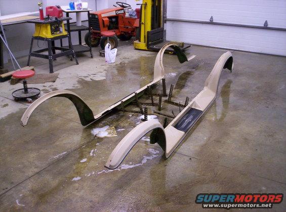 Tan fender flares and running boards on a concrete floor