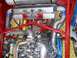 1993 Ford Taurus - Custom engine bay features polished turbochargers, an intercooler, and a red roll cage, suggesting a high-performance application.