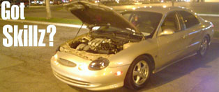 Silver 1998 Mercury Sable sedan with hood open