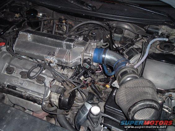 Ford engine with custom aluminum intake manifold and aftermarket air filter