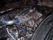 1994 Ford Probe - Custom intake manifold installed in an engine bay, with visible handwritten notes on the manifold.