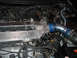 1994 Ford Probe - Custom intake manifold with handwritten notes and PCV fittings shown in an engine bay.
