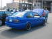 1998 Volkswagen Jetta - A custom Volkswagen Jetta pickup conversion is parked in a lot with other vehicles and people around.