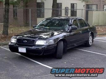 Black 2001 Ford Crown Victoria parked in a lot