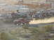 1999 Ford F-250 - A red off-road truck races across a dusty track, with spectators and other vehicles in the background.