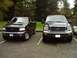 2002 Ford F-150 - Two Ford trucks, an F-150 and an Excursion, are parked side-by-side in a lot.