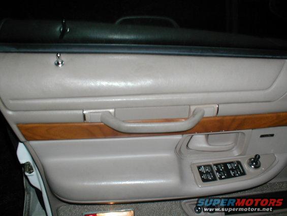 Interior door panel with wood trim and power window controls