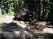 1992 Ford F-150 - Red 1992 Ford F-150 tackling a challenging rocky path in the woods.