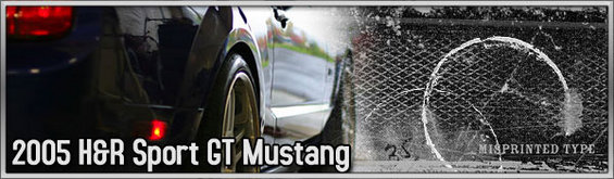 2005 Ford Mustang rear quarter panel, taillight, and wheel. Text overlay reads '2005 H&R Sport GT Mustang'