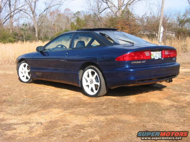 Blue 1993 Ford Probe GT rear 3/4 view with white wheels