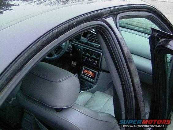 1995 Ford Contour interior showing dashboard, seats, and aftermarket stereo screen