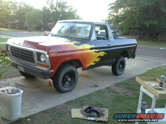 Red and black truck with flame decals, 3/4 front view