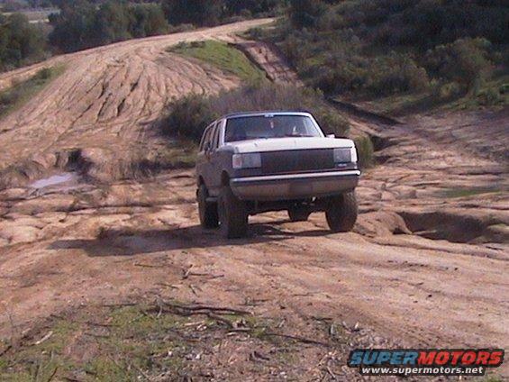 1991 Ford Bronco on a dirt trail