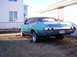 1971 Chevrolet Chevelle - Rear view of a teal 1971 Chevrolet Chevelle coupe with a black vinyl top and aftermarket wheels.