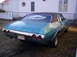 1971 Chevrolet Chevelle - The rear of a teal 1971 Chevrolet Chevelle is shown parked on grass with a house in the background.