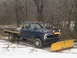 1977 Ford F-250 - Ford F-250 flatbed truck equipped with a snow plow, seen after purchase in winter conditions.