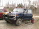 1977 Ford F-250 - A 1977 Ford F-250 is parked outside with its driver's door open and a shop vac connected.
