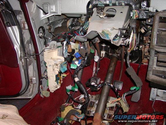 A pic of the steering column dropped. Keep in mind the harness under the dash that had to be swapped included the fuse panels and was so thick it was held to the firewall with 10mm nuts.