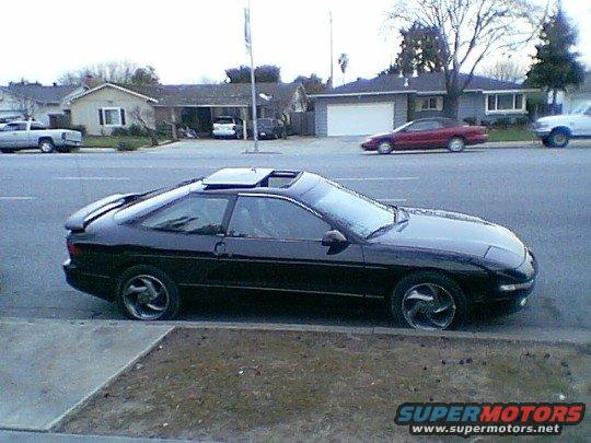 Black 1993 Ford Probe coupe with sunroof parked curbside