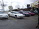 1993 Ford Probe - Several Ford Probes are parked in a lot under an overcast sky.