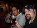 1993 Ford Probe - Two friends are enjoying drinks at a bar, with one man wearing a baseball cap.
