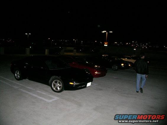 1993 Ford Probe and other cars parked at night