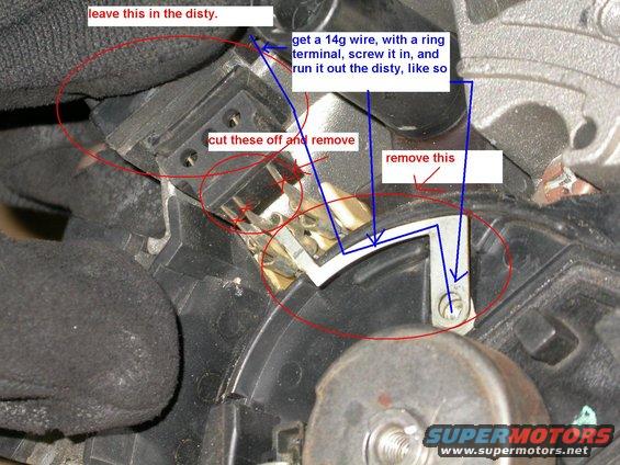 Close-up of automotive part with handwritten instructions for wiring