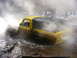 1990 Ford Bronco - This yellow Ford Bronco is navigating through a muddy, watery obstacle course.