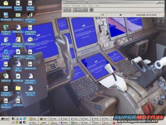 Airplane cockpit with multiple blue screens and control levers