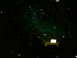 1990 Ford Bronco - A green SUV with a damaged windshield is seen from the front at night, with a yellow tow hitch attached.