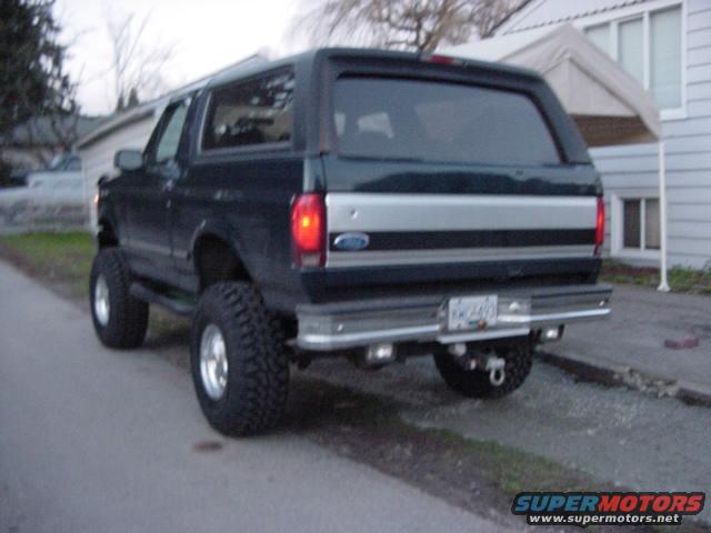 Dark green 1993 Ford Bronco rear view with large tires