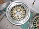 1998 Volkswagen Jetta - A close-up of a gold mesh car wheel with a silver lip and visible bolts.