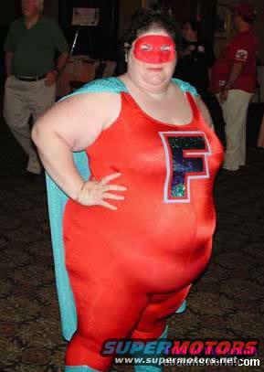 person in a red and blue superhero costume with a cape and a mask, standing with hand on hip