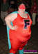 1990 Ford Bronco - A person poses in a superhero costume, complete with a cape and a mask.