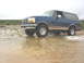 1996 Ford Bronco - This blue 1996 Ford Bronco is captured mid-drive through a watery terrain.